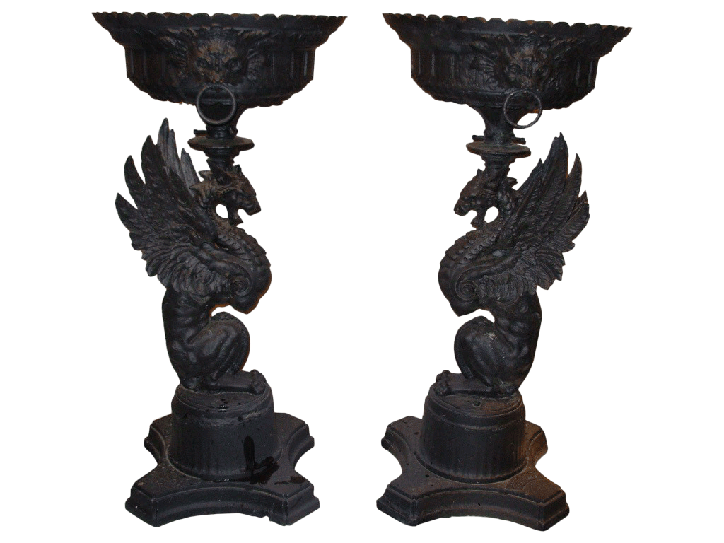 Pair of ornate black dragon-themed garden urns