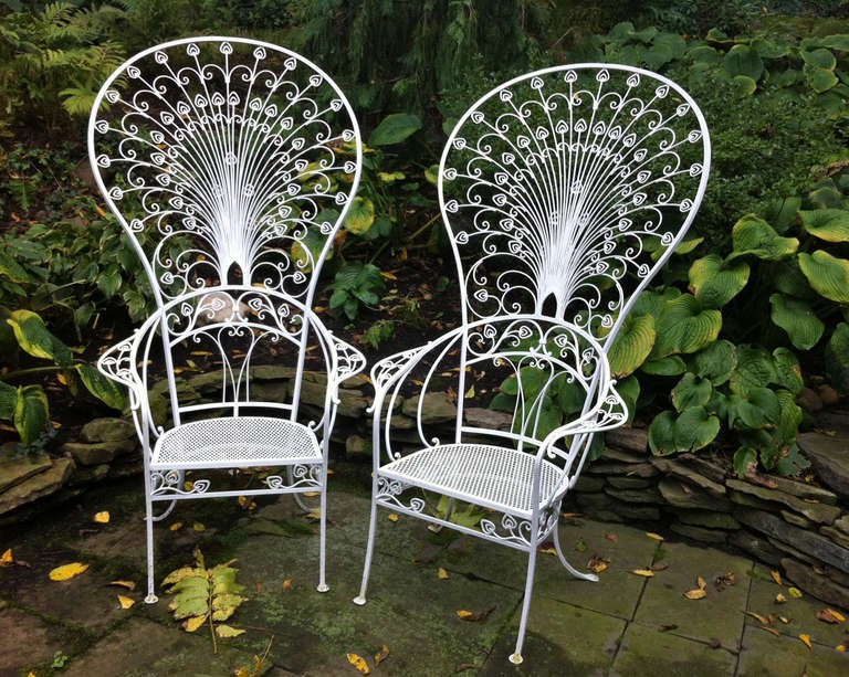 two white vintage patio chairs